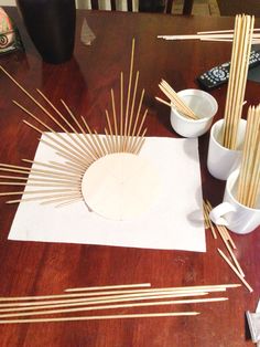 the table is covered with sticks and bowls