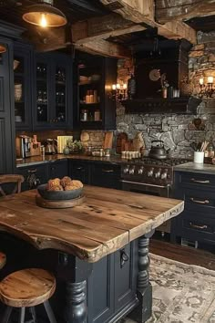 a rustic kitchen with black cabinets and wooden table