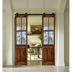 an open door leading into a dining room