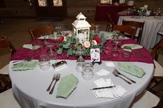 the table is set with place settings and napkins