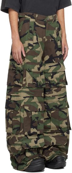 Wide-leg cotton twill cargo pants. Camouflage pattern printed throughout. · Paneled construction · Belt loops · Cinch straps at waistband · Four-pocket styling · Zip-fly · D-ring straps at front and back · Cargo pockets at front and outseams · Logo-engraved silver-tone hardware Supplier color: Camo Vetements Pants, Camo Cargo Pants, Green Power, Power Ranger, Camo Pants, Silver Engraving, D Ring, Luxury Streetwear, Cargo Pants