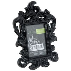 an ornate black frame with a barcode sticker on the front and back side