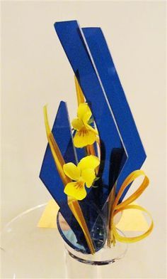 a vase filled with yellow flowers on top of a table