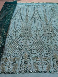 an image of a table cloth with beading on it