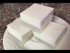 three squares of white soap sitting on top of a plate