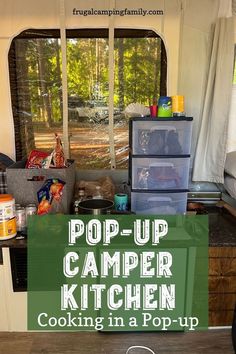 a camper kitchen with the words pop up camper kitchen cooking in a pop - up