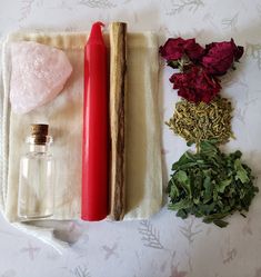 herbs, salt and pepper shakers are laid out on a tablecloth with flowers