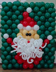 an image of a balloon santa clause in the shape of a wreath with balloons around it