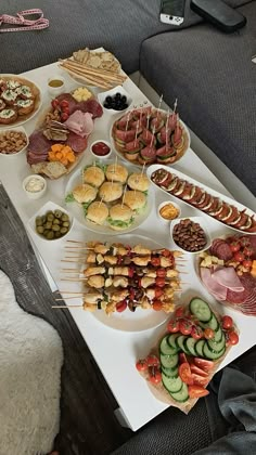 a table topped with lots of different types of food