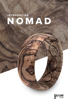 a wooden ring with the words nomad on it