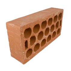 a brick with holes in it on a white background