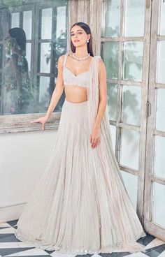 stylish white lehengas, fashion, diamond neacklace with diamond stud earrings, girlish white lehenga look, shimeery white lehengas, bustier sleeveless lehenga blouse, party makeup look, indian ethnic wear, indian bridesmaid outfit, aesthetic in frame - anayapanday White Lehenga Party Wear, White Lehenga Bridesmaid, Sleeve Less Blouse Designs For Lehenga, Jewellery With Lehenga, Ananya Pandey Lehenga, White Skirt Outfit Traditional, White Blouse Lehenga, Lehenga Designs Stylish, Lehenga Designs Sleeveless