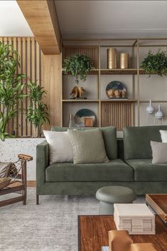 a living room filled with furniture and lots of plants