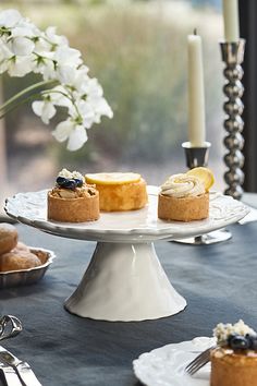 an assortment of pastries on a cake stand