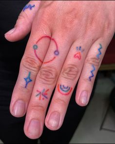 two fingers with different designs on them, one has a ring and the other has an arrow