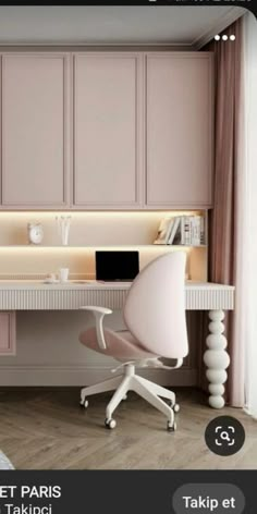 a pink desk and chair in a room