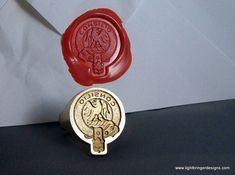 a wax seal with the word ontario on it next to a stamp that says canada