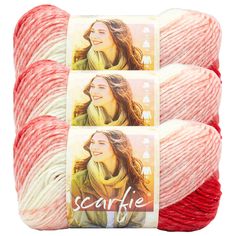 three skeins of red and white yarn with the words scarfie on them