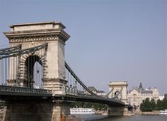 an old bridge spanning the width of a large body of water