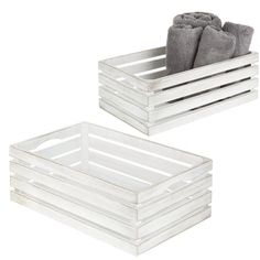 two white trays with towels in them