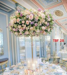 the table is set with plates and place settings