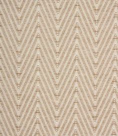 a beige and white area rug with zigzag pattern