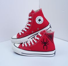 Handcrafted from premium materials, these sneakers not only deliver outstanding aesthetics but also prioritize comfort for your special day. Whether you're walking down the aisle or on the dance floor, Chuck Taylor 1970s embroidered with custom spider webs ensure you stand out every step of the way.          Custom embroidered converse/Spiderweb embroidered shoes/Converse high tops embroidered spiderweb/Spiderweb embroidered sneakers/gift for son  💸 Price include Shoes and floral embroidery as Spider Man Converse, Spiderman Shoes, Embroidered Shoes Converse, Embroidered Sneakers, Embroidered Converse, Red High Tops, Ellie Shoes, Hand Embroidered Flowers, Shoes Converse