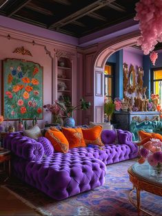 a living room filled with lots of purple furniture