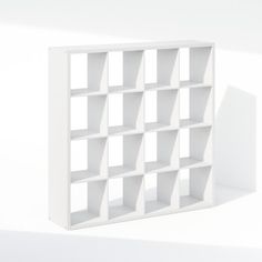 a white bookcase with several open shelves on the top and bottom, against a white background