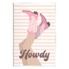 a woman's hand holding up a pink boot with the word horvy on it