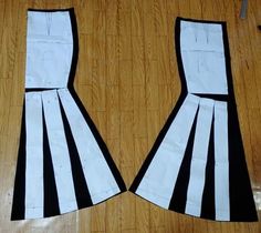 two pieces of paper are cut out to look like they have been made into dresses