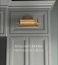 an image of a kitchen cabinet with the name benham moore providence blue on it