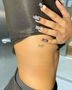 a woman's lower body with tattoos on it