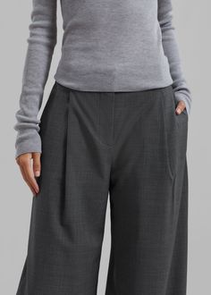 Color: Grey Melange Lightweight wool blend fabric Relaxed fit Straight leg High rise Slant hip pockets Belt loops Zip fly Hook and bar closure Unlined 48% Wool 30% Recycled Polyester 16.5% Polyester 5.5% Lycra Dry Clean Only By The Garment. Imported Chic Wool Wide Leg Pants With Pockets, Winter Workwear Bottoms With Hip Pockets, Modern Wide Leg Wool Bottoms, Gray Workwear Bottoms For Fall, Workwear Bottoms With Hip Pockets For Fall, Wool Bottoms With Welt Pockets For Business Casual, Classic High Waist Wool Wide Leg Pants, Modern Winter Bottoms With Pockets, Wide Leg Wool Bottoms For Fall