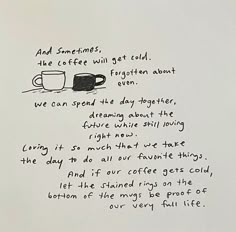 a handwritten poem on white paper with black ink and coffee mugs in the background