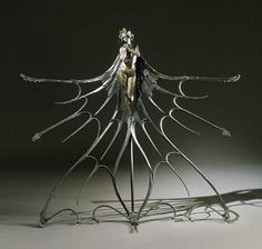 a metal sculpture sitting on top of a table