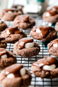 chocolate cookies with marshmallows on a cooling rack