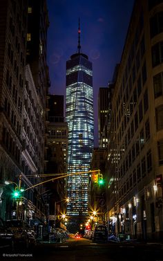 a very tall building lit up at night