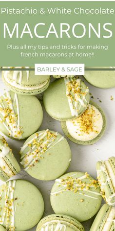 green macarons with white frosting and sprinkles in the middle