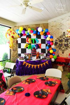 a birthday party with balloons and decorations