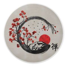 a white plate with red flowers on it and a bird flying in the sky above