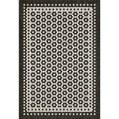 a black and white rug with an intricate design