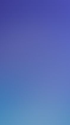 a group of people standing on top of a beach flying kites in the sky