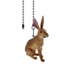 a brown rabbit figurine hanging from a chain