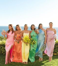 the bridesmaids are all wearing different colored dresses