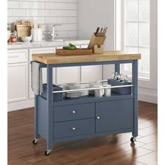 a kitchen island with two drawers and plates on it