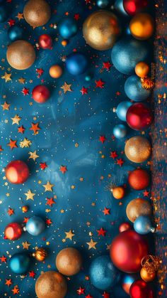 christmas balls and stars on a blue background with gold, red and blue tinsel