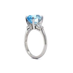 Santa Maria Aquamarine Diamond Ring in Platinum. Aquamarine stones are mined in locations all around the globe but some of the finest gem specimens are found in Brazil. In fact, it was in the Santa Maria de Itabira mine in Menas Gerais, Brazil, where the original aquamarine gemstone possessing a unique, deeply saturated blue hue was discovered. That is why aquamarine stones with such a color are now dubbed ‘Santa Maria,’ regardless of their origin. This beauty is flanked by glittering diamonds o Saturated Blue, Diamond Glitter, Right Hand Rings, Sapphire Color, Metal Shop, Aquamarine Stone, Aquamarine Gemstone, Platinum Ring, Shop Engagement Rings