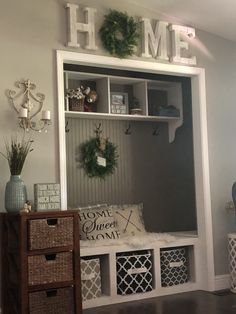 the entryway is decorated with wreaths, baskets and decorative items for decorating