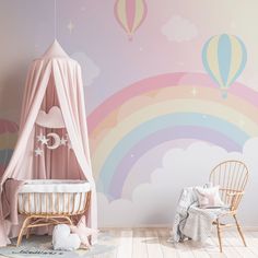 a child's room with a rainbow wall mural